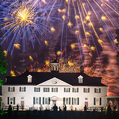Fireworks over a building. Links to Gifts by Estate Note